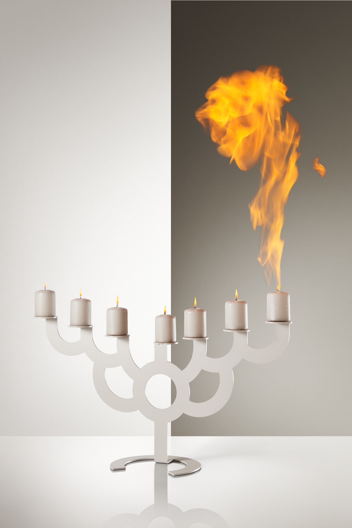 Bold candle holder satin front view with candles and a flame 